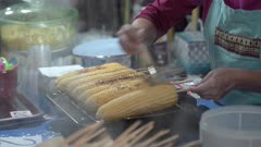 Grilled corn on the cob at night market in Chiang Mai, Thailand, Southeast Asia, Asia