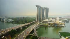 Day to night time lapse of traffic on Benjamin Sheares Bridge to Marina Bay Sands Hotel, Singapore, Southeast Asia, Asia