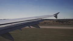 View of plane landing taken out of airplane window, Madrid, Spain, Europe