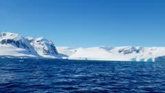 Scenic view of the icebergs and glaciers across the water of Antarctica, Polar Regions