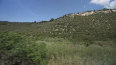 View of North Sardinia countryside from moving train between Olbia and Sassari, Sardinia, Italy, Mediterranean, Europe