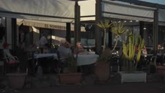 People relaxing at restaurant and harbour at sunset, Corralejo, Fuerteventura, Canary Islands, Spain, Atlantic Ocean, Europe