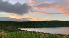 Sunset over Caldeira Rasa with colored clouds in the sky, Flores Island, Azores, Portugal, Atlantic