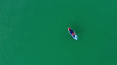 Aerial of woman and young girl kayaking on paddle board in the Camel Estuary, Cornwall, England, United Kingdom, Europe