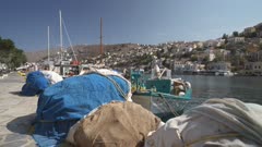 Boats and quayside in Symi Town, Symi Island, Dodecanese Islands, Greek Islands, Greece, Europe