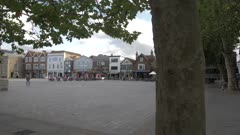 Shot past tree to Market Square, Salisbury, Wiltshire, England, United Kingdom, Europe