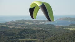 Paraglider from mountain top of Mirador Cim del Toro, Es Mercadal, Menorca, Balearic Islands, Spain, Mediterranean, Europe