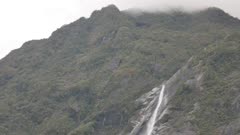 Waterfall cascade from top at Franz Josef Glacier