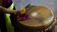 Close up Chinese drum performance by hitting with stick