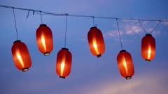 Close up Japan lantern ornament hanging during blue hour during Bon Odori
