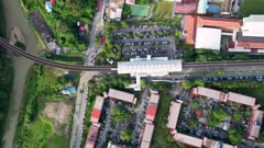 Aerial top down view LRT leave the station Sentul