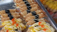 Tilt down Japanese sushi food on silver plate