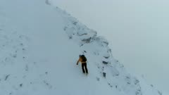 Mountain Climber on a Challenging Snowy Climb