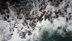 Bird's Eye View of Waves Crashing on a Rocky Coast