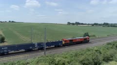 Freight Train Travelling Through The Countryside