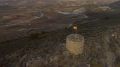 Circling an Old Abandoned Lookout Tower with a Spanish Flag