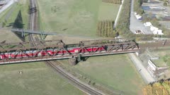 Commuter Train Passing Over an Old Iron Bridge