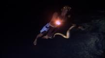 Native Free Diver In Snake Cave With Light, Catches Snake