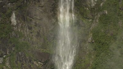 Zoom out on waterfall to reveal surrounding scenery