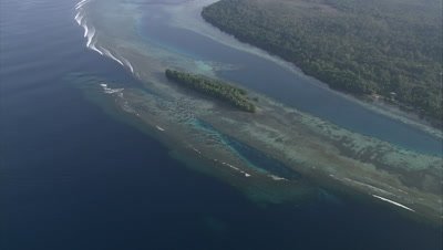 circling island coast and shallow reef below