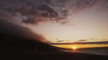 Time Lapse Fog And Clouds At Sunset On Rugged Coast