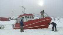 People Attempt To Free Boat Trapped In Ice And Snow