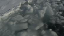 View Looking Down From Boat Traveling Through Melt Ice, Tilt To Shoreline