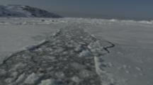 View From Boat Traveling Through Channel In Melt Ice Toward Shore