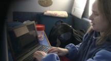 Woman On Research Ship Working Up Data On Computer