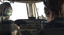 Helicopter Pilot And Passengers Prepare For Takeoff