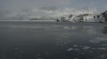 View From Boat Traveling Through Melt Ice Along Greenland Coastline