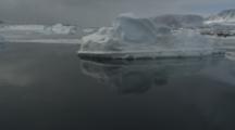 Travel Past Icebergs And Arctic Coastline
