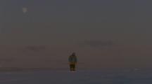 Inuit Man Stands On Ice, Possibly With Harpoon