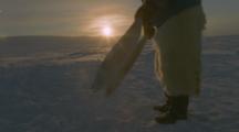 Inuit Transfer Frozen Fish To Sled