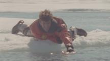 Film Maker Lies On Ice With Camera In Water Waiting For Bowhead Whales
