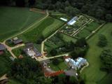 Aerial English Mansion Surrounded By Green Farmland