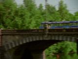 Passenger Train Crosses Bridge 