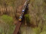 Aerial Train Rolling Through Countryside