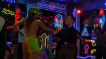 Salsa Dancers And Neon Lights