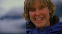 Pan From Water And Snowy Mountains To Portrait Of Heather Lende Laughing And Smiling