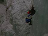 Ice Climbing On Sheer Cliff Face
