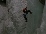 Ice Climbing On Sheer Cliff Face