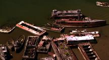 Shipyard Filled With Rusty Old Ships And Boats - Aerial Around Coastline
