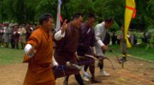 Men Practicing A Traditional Archery Dance