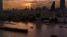 Barge Crosses In Front Of Bangkok Skyline, From Across River 