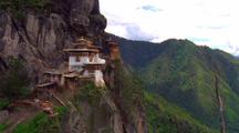 Tilt Up To Buddhist Temple Built Into Rocky Mountainside, Paro