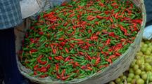 Tilt To From Red And Green Peppers To Vendor At The Marketplace