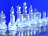 Glass Chess Set In Front Of Blue Screen