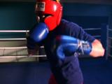 Woman Boxer Practices In Ring