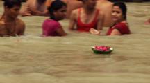 Man Offers Flowers During Ritual Bath In Ganges River